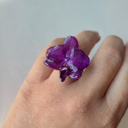 ANELLO IN ACCIAIO CON FIORE DI ORCHIDEA VERA